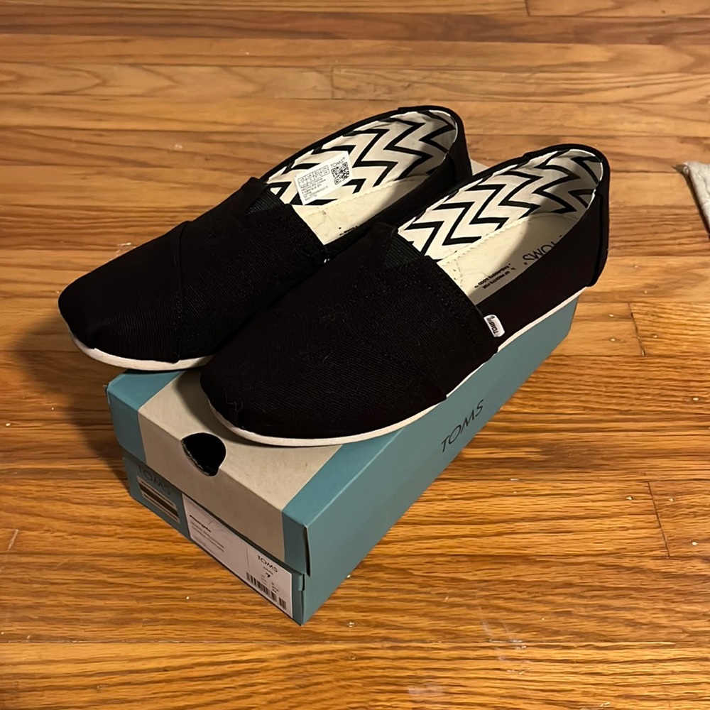 TOMS black classic canvas slip ons
